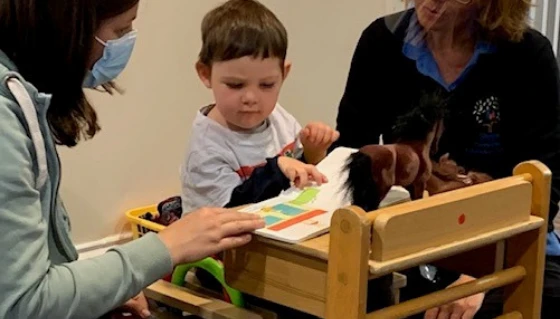 Thomas plyaing with his mum and a Conductor at Steps Conductive Education Centre showing how Steps helps families